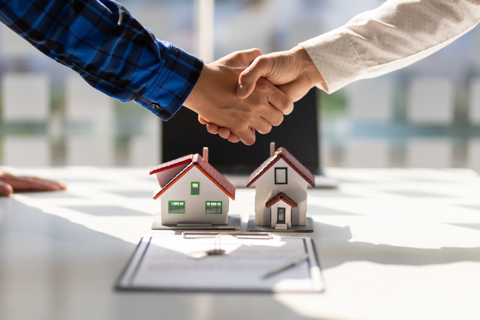 A Collaborative Realtor closes a deal with a client.